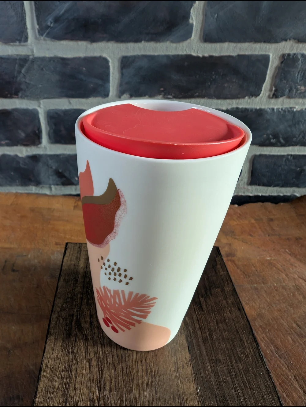 Starbucks White Ceramic Travel Mug with Coral Lid and Pinecone Accent